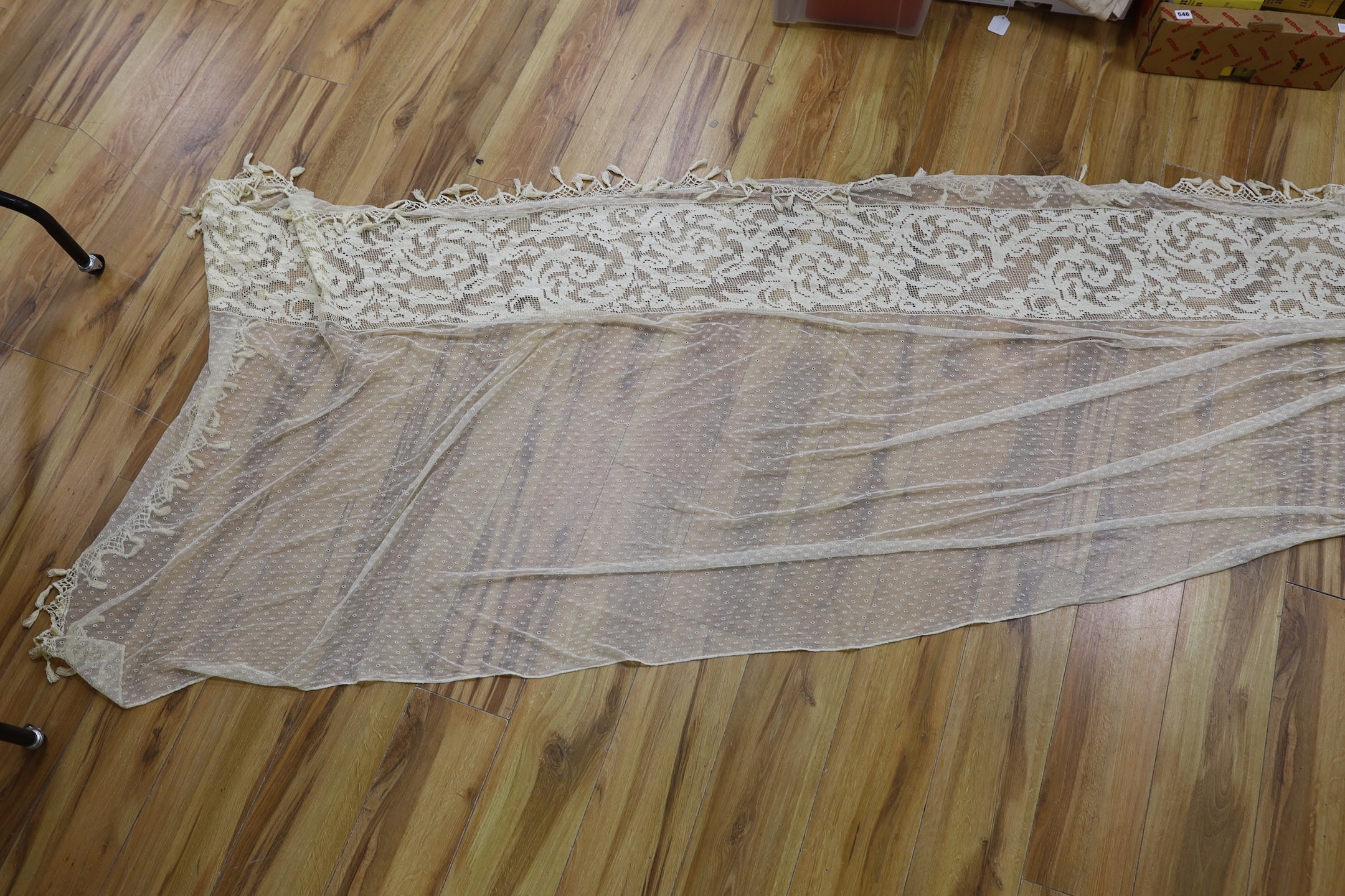 A pair of Edwardian fine net curtains bordered with wide fillet lace, edged with tasselled bobbin lace 272 x 155cm